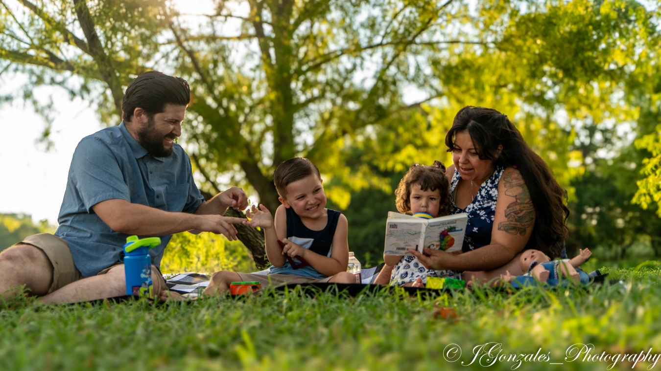 Family laughing together outdoors
