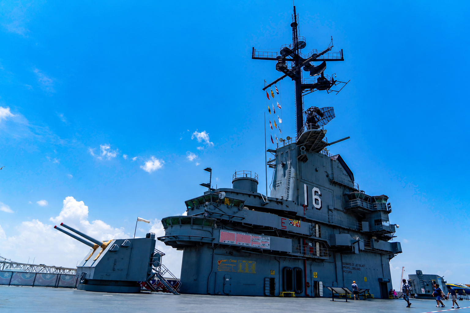 Historic naval ship beneath a vivid blue sky
